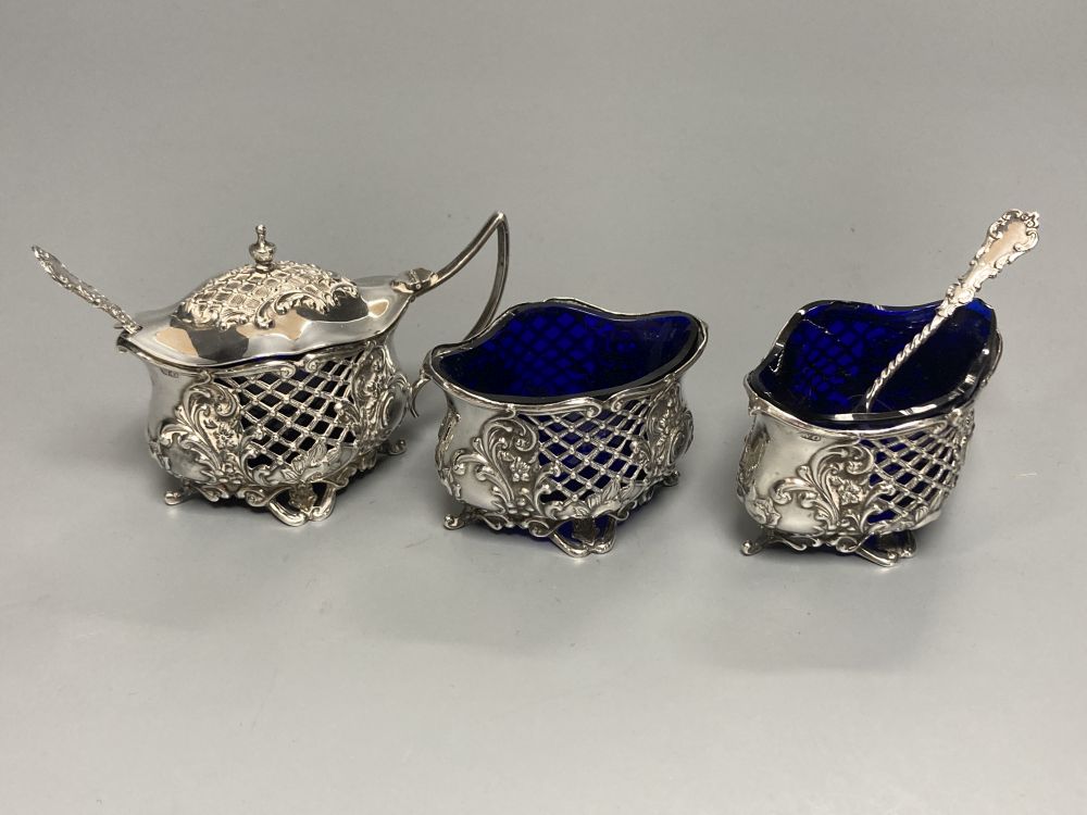 An Edwardian pierced silver three piece quatrefoil condiment set by William Oliver, Birmingham, 1906,